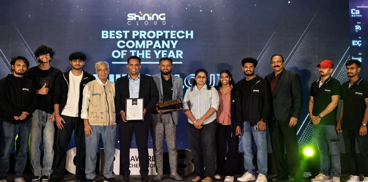 Shining Cloud team at the GREBA Awards 2025 beside the Best PropTech Company of the Year award